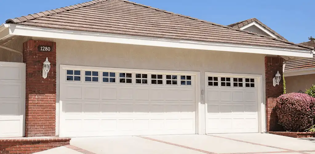 Residential garage door repair service for a double garage door in Tacoma, WA