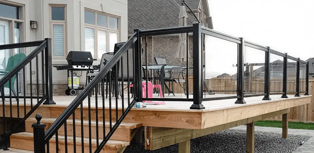 Handrail installation on a deck staircase for safety and code compliance in Tacoma, WA